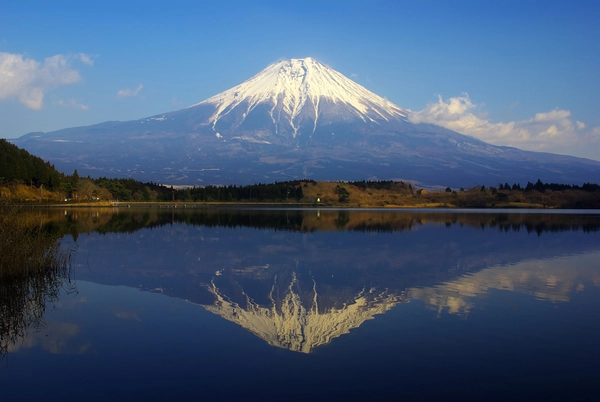 Sakasa-Fuji double reflection of Mount Fuji in Lake Tanuki at sunrise with mirror-perfect water surface